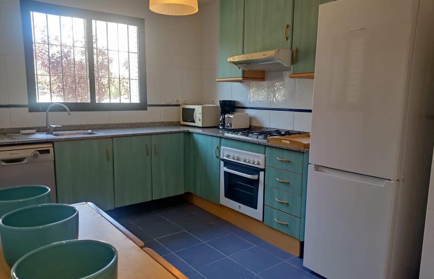 Separate kitchen with hob, oven and dishwasher