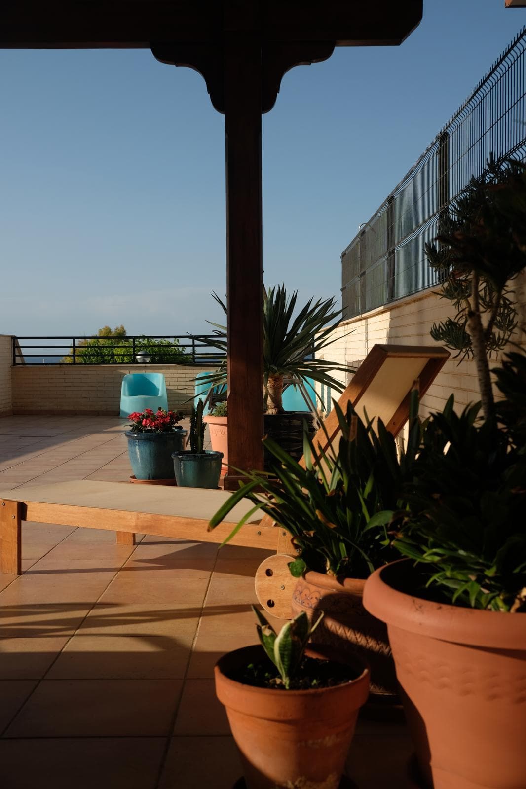 Sun loungers on the covered terrace